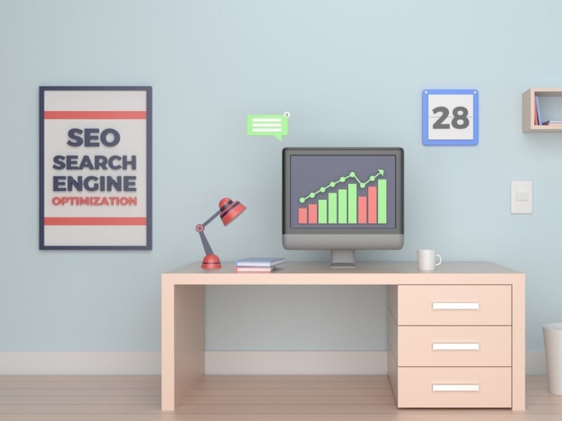 Modern office desk with computer analysing web marketing packages performance graph.