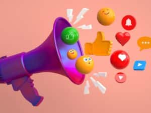 3D megaphone surrounded by social media icons and emoji symbols representing engagement in industry marketing solutions