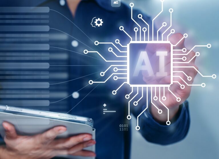 professional holding a tablet while interacting with a glowing AI chip graphic representing data processes and AEO systems.