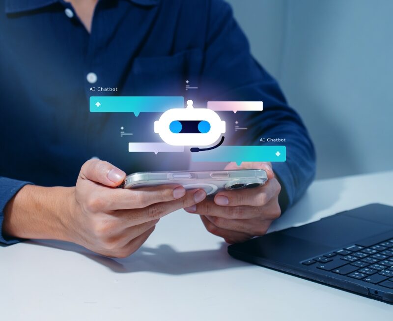 A user holding a smartphone that displays a glowing robot chatbot graphic, representing an interactive ai search assistant interface.