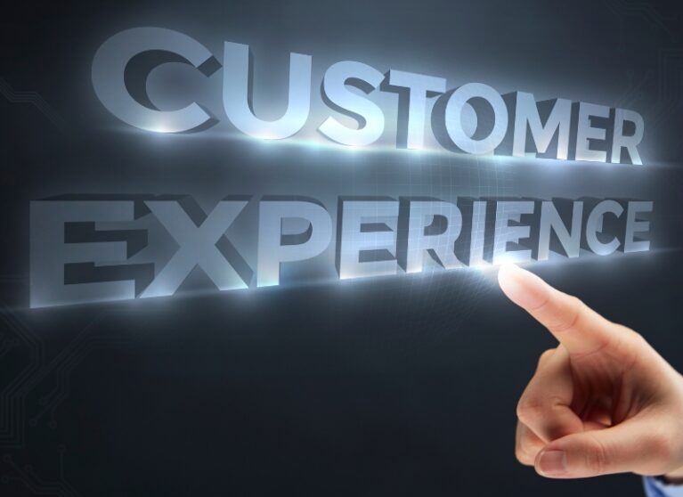 A finger pointing at glowing 3D text reading "CUSTOMER EXPERIENCE" to highlight AI Automation solutions.