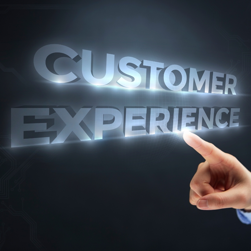 A finger pointing at glowing 3D text reading "CUSTOMER EXPERIENCE" to highlight AI Automation solutions.